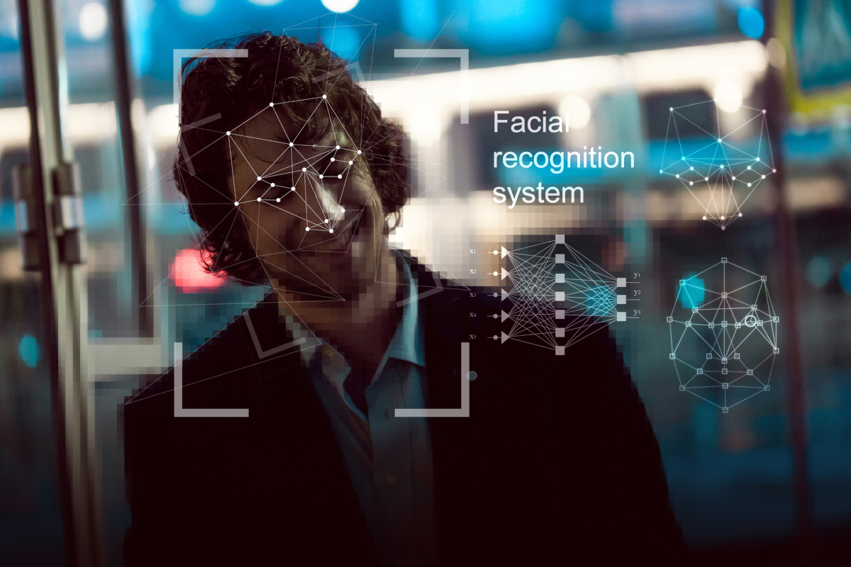 Smiling Man Being Scanned by Facial Recognition Software