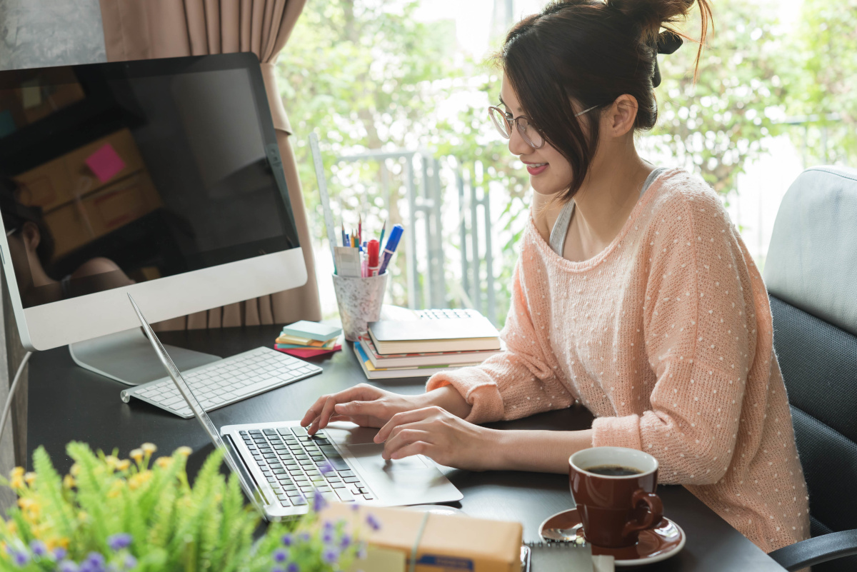 A woman working from home at her desk
