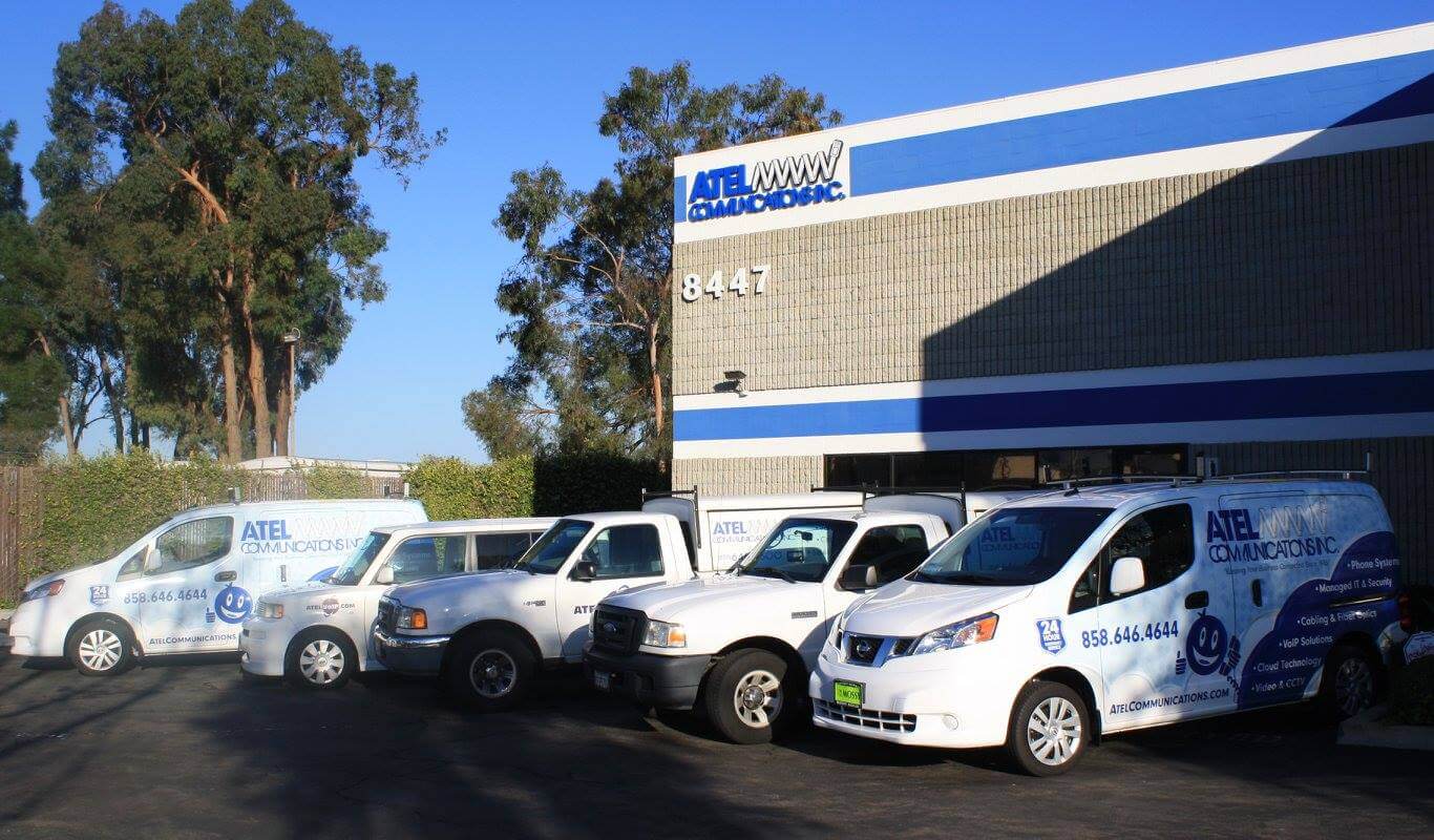 Service and Support Vehicles Parked in Front of ATEL Communications Building